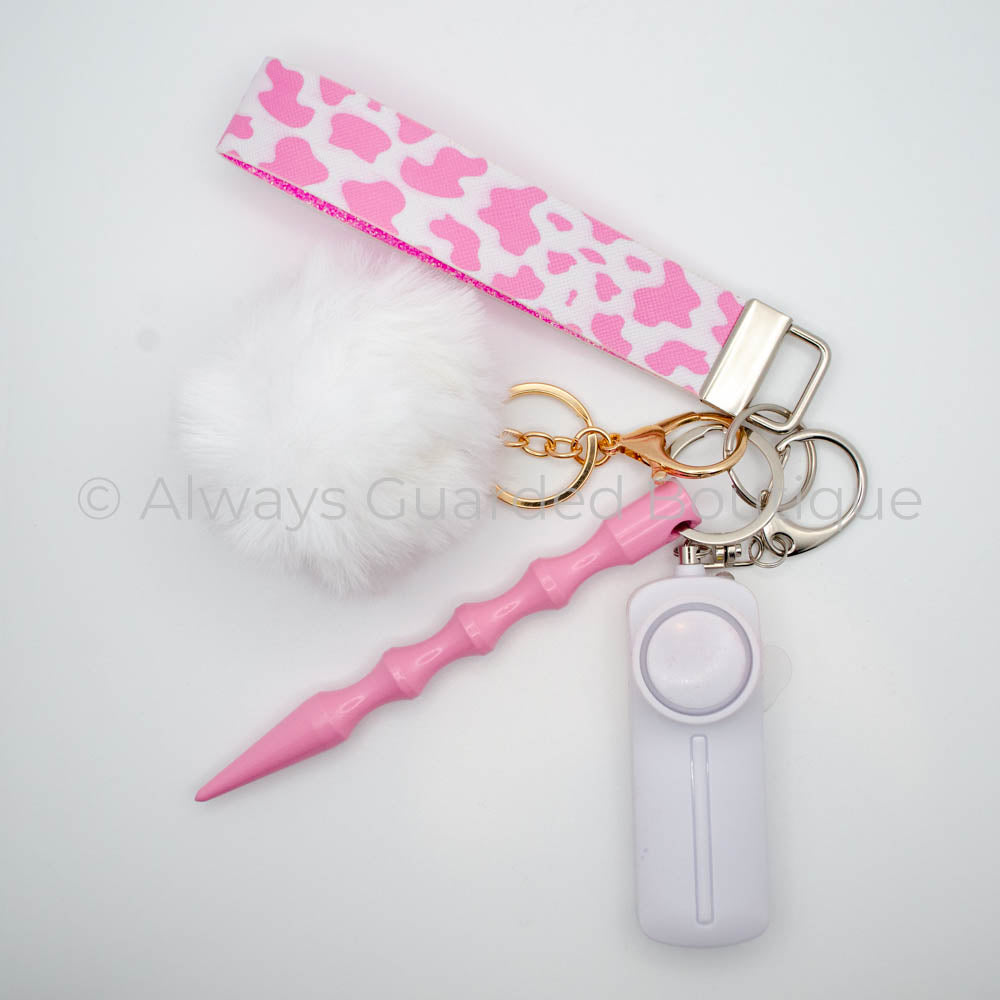 Trendy Cow Print Keychain with White Faux Fur Pom Pom and Premium Alarm