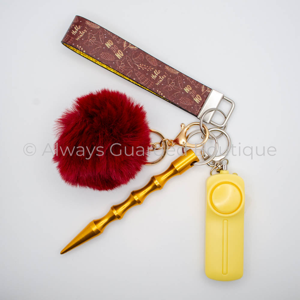 Hello Winter Christmas Guardian Safety Keychain - Festive Wristlet, Faux Fur Pom Pom, Kubaton, and Premium Alarm with Built-In Flashlight